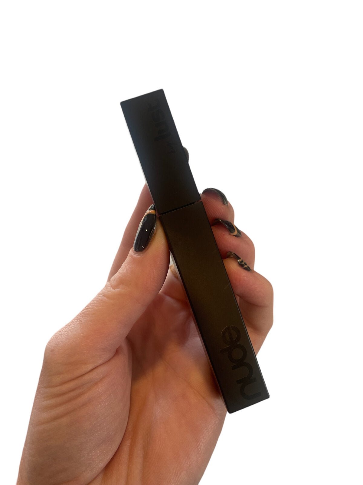Nude by lust waterproof mascara in the shade black.