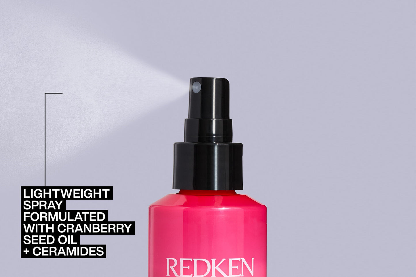 Redken thermal spray low hold spray bottle with product details.