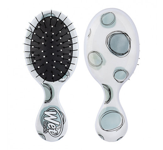 The wet brush mini in the colour teal polka dots